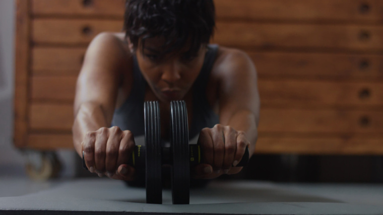person on an ab wheel