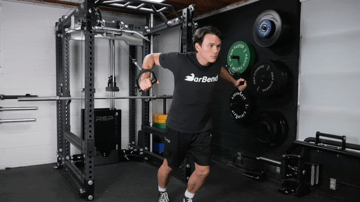 BarBend's Jake Herod performing the cable chest flye exercise.