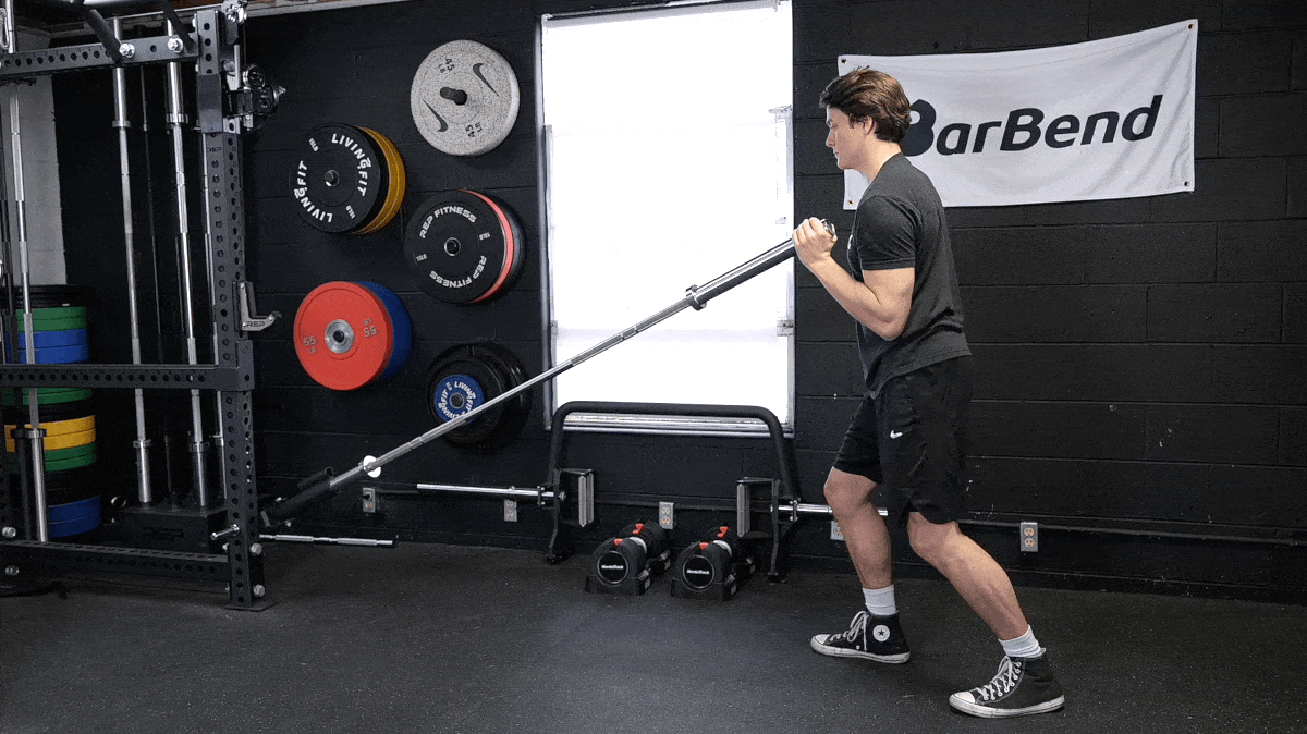 BarBend's Jake Herod performing the landmine press exercise.