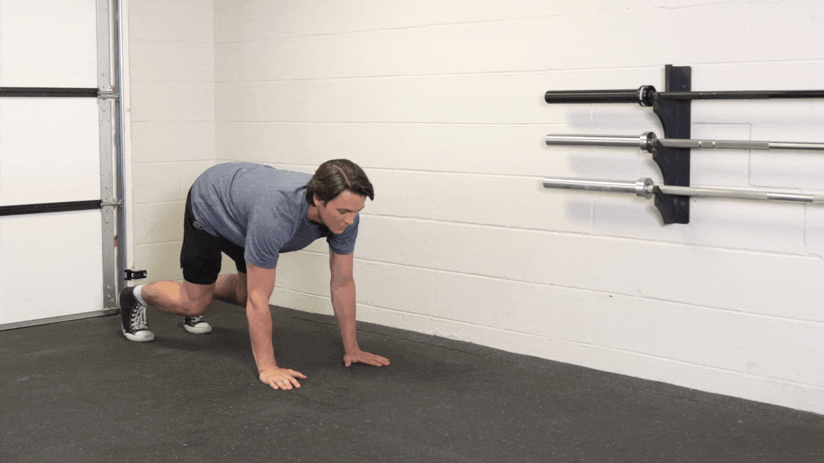 A person doing the bear crawl exercise.