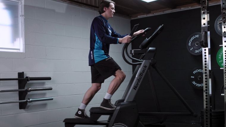 BarBend's Jake Herod on the elliptical in the Barbend gym.