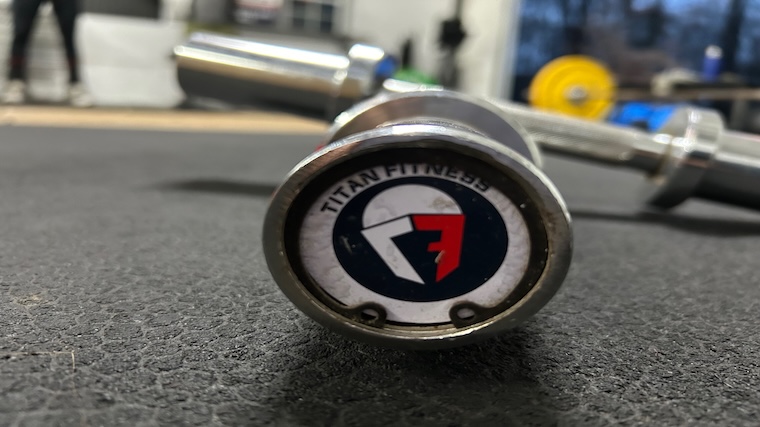 Titan Fitness Loadable Dumbbell endcap.