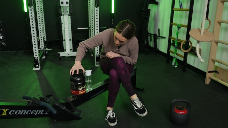 Our tester getting ready to mix a shake of Optimum Nutrition Gold Standard Whey Protein